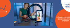 Titelbild Blogbeitrag Influencermarketing. Im Vordergrund ein Smartphone, das die Influencerin im HIntergrund aufnimmt.